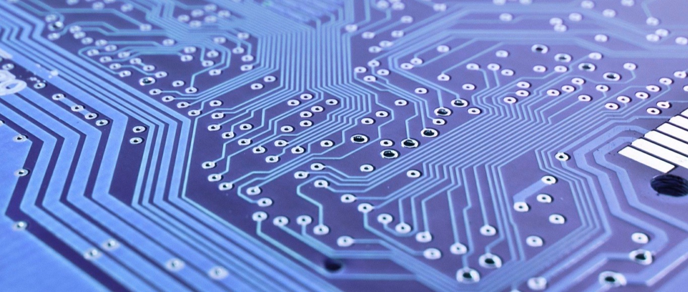computer technology closeup image of a blue motherboard