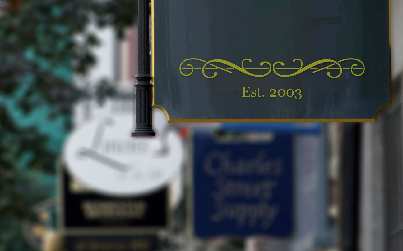 trademark showing closeup of est. 2003 on sign